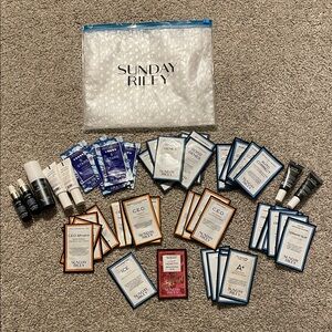 Sunday Riley sample bundle with lux and gift samples, includes pouch.  Unused.